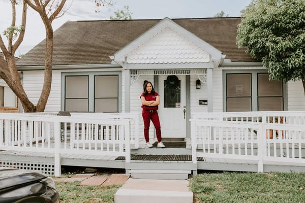 Staff member welcoming guests at the facility entrance