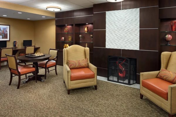 Cozy common area with seating and a fireplace