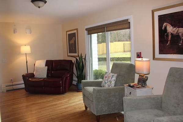 Bright interior common area with seating and natural light