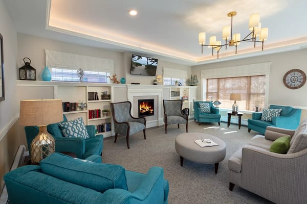 Bright and inviting living room with seating and a fireplace