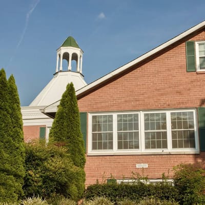 Exterior view of the facility with green landscaping