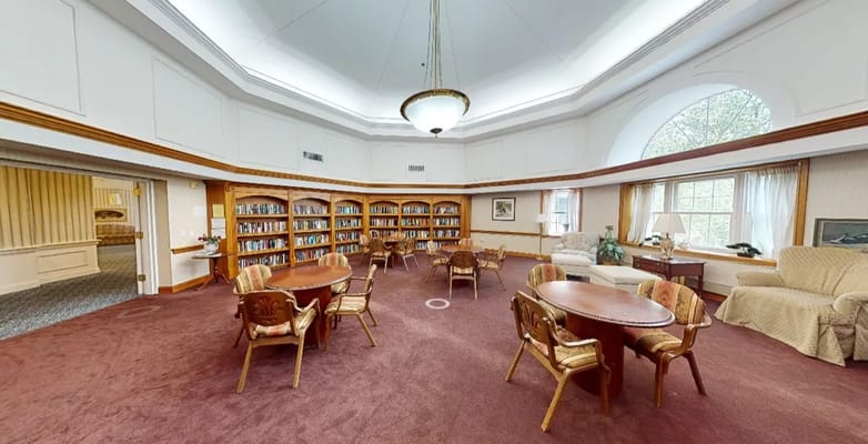 Cozy common area with bookshelves and seating