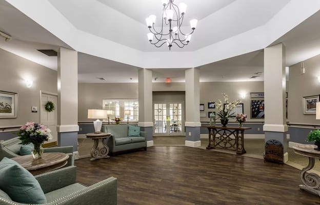 Spacious lobby with seating and decorative plants at Concord Place