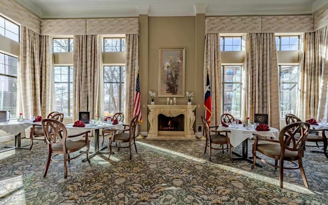 Elegant dining room with tables set for meals