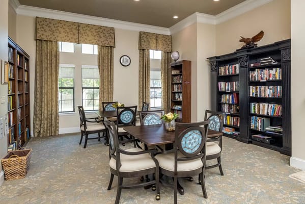 Bright common area with bookshelves and seating