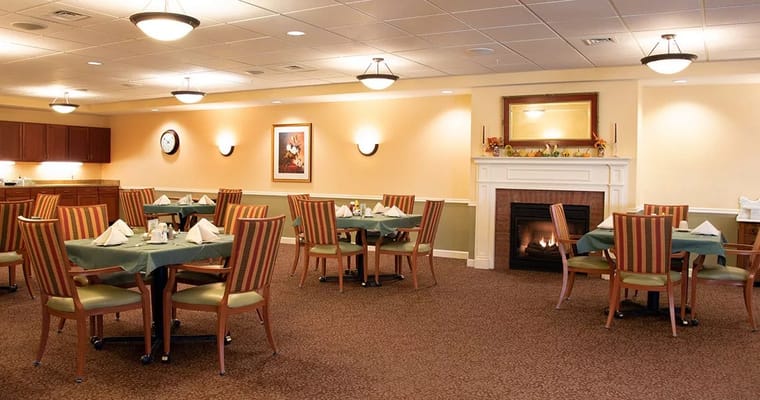 Bright dining room with tables and chairs arranged