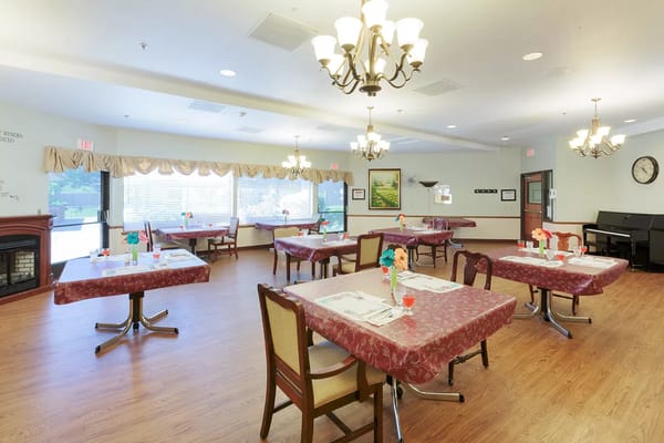 Dining area with tables set for residents