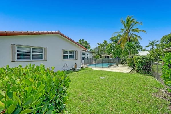 Outdoor view of a facility with a pool in the background