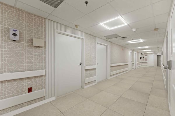 Bright, clean interior corridor of a healthcare facility