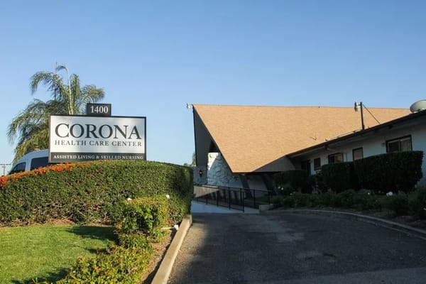 Exterior view of Corona Health Care Center with signage
