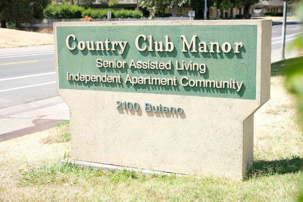 Sign for Country Club Manor, a senior assisted living community