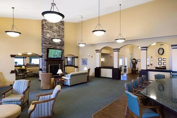Interior view of a common area with seating and a TV