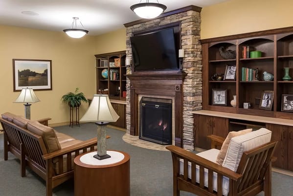 Cozy common area with seating and a fireplace