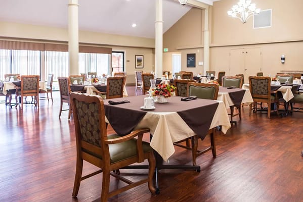Dining room set with tables and chairs ready for meals