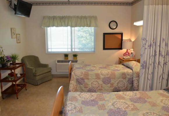 Shared resident room with two beds and décor