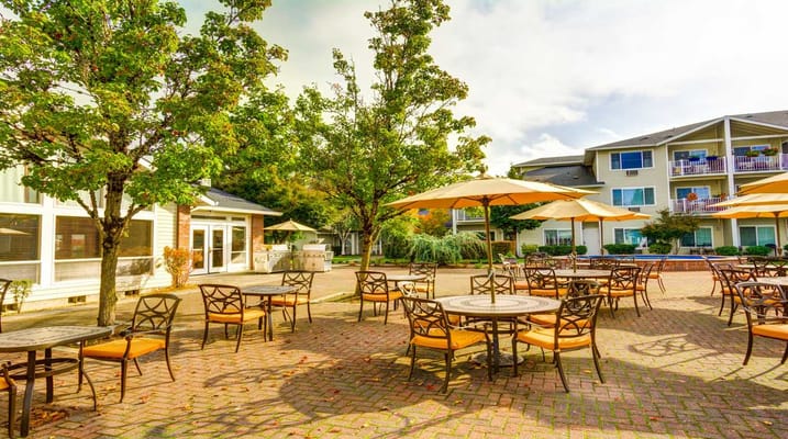 Outdoor patio area with tables and chairs