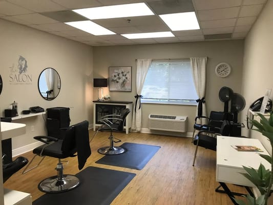 Interior view of a hair salon with styling chairs