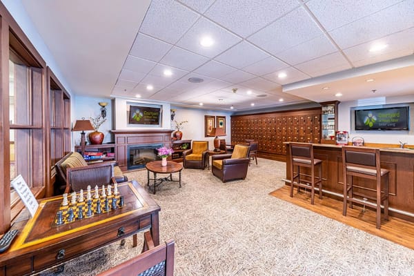 Welcoming living room area with comfortable seating and a chess table.