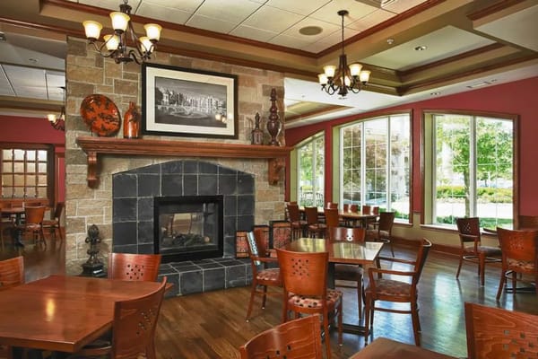 Cozy dining room with warm lighting and furnishings