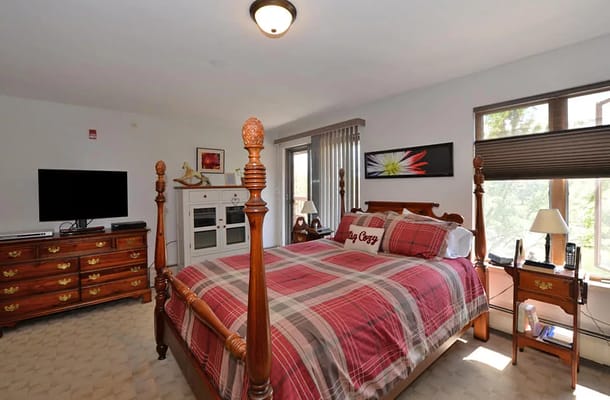 Cozy private resident room with a bed and TV