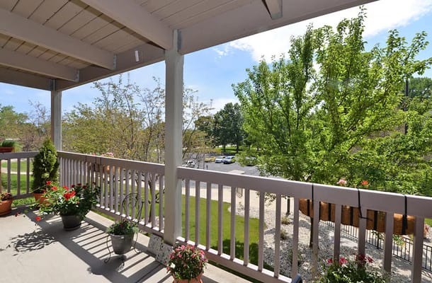 View from a balcony with planters and trees