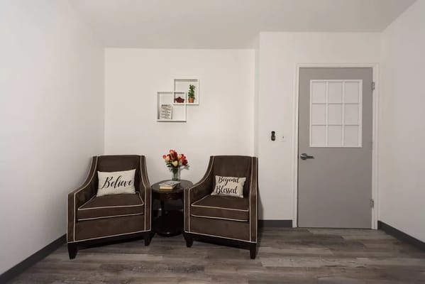 Cozy lounge area with two armchairs and decor