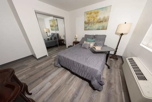 Cozy private room with a bed and artwork