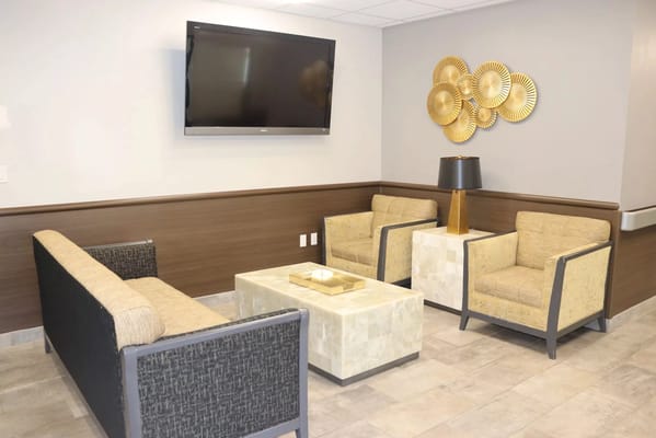 Interior common area with seating and TV