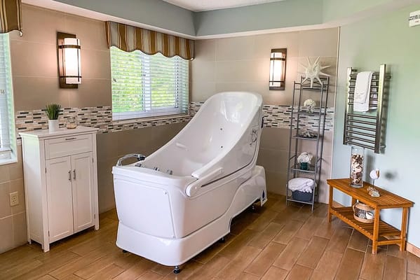 Well-appointed spa room with a specialized bathtub