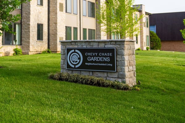 Facility logo and sign in a landscaped area