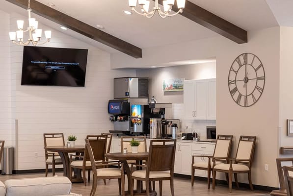 Bright common area with seating and refreshments