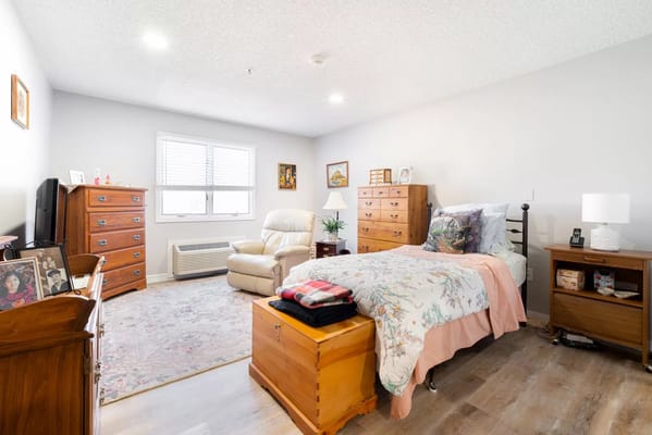 Private resident room with a bed and furniture