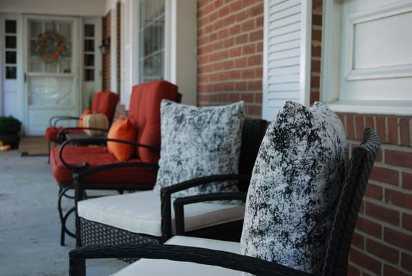 Cozy outdoor seating area with decorative cushions