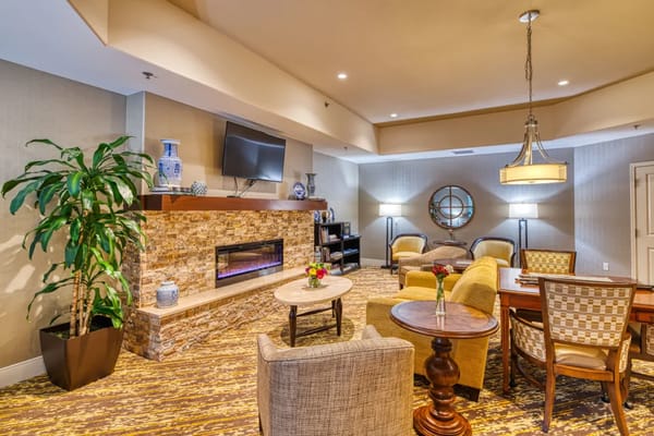 Cozy common area with seating and a fireplace