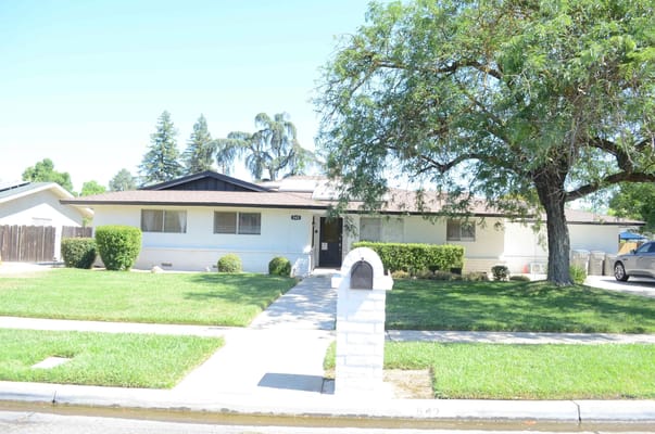 Exterior view of Evergreen Life Care Homes showing front entrance and landscape