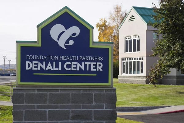 Denali Center facility sign with logo