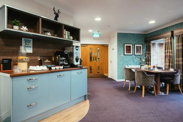 Interior view of a common area with seating and refreshments