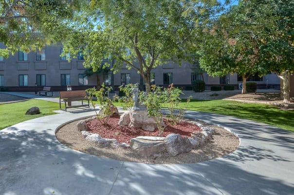 Well-maintained garden area with a seating bench