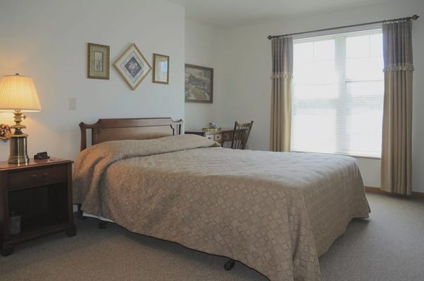 Cozy private resident room with bed and window