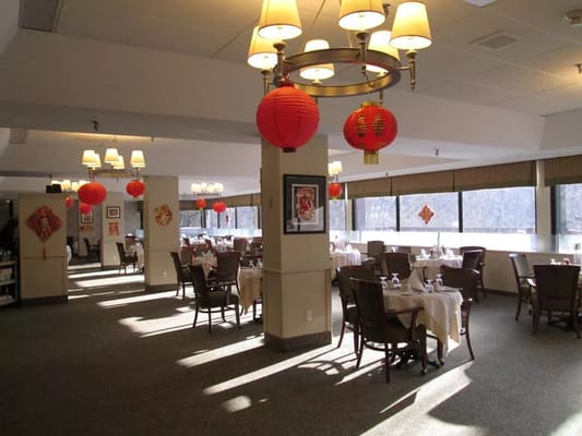Dining area with tables set and festive lanterns