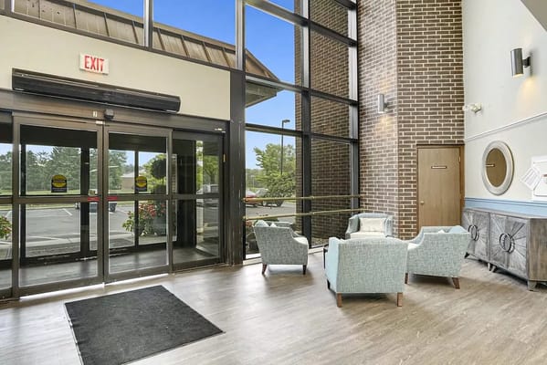 Lobby area with glass entrance and seating