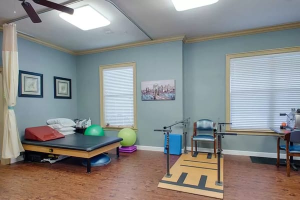 Therapy room with rehabilitation equipment and exercise balls