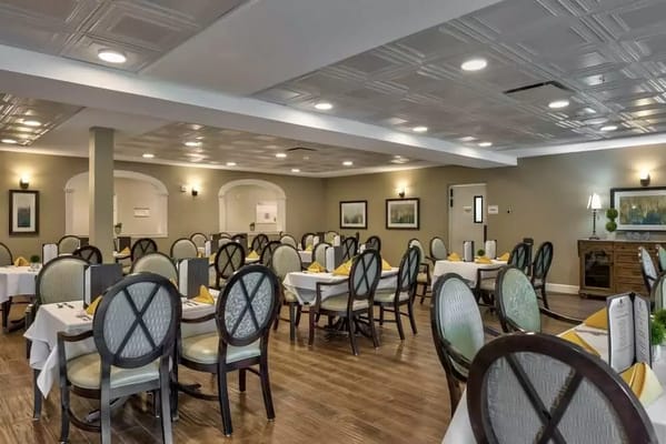 Bright dining area with tables set for meals
