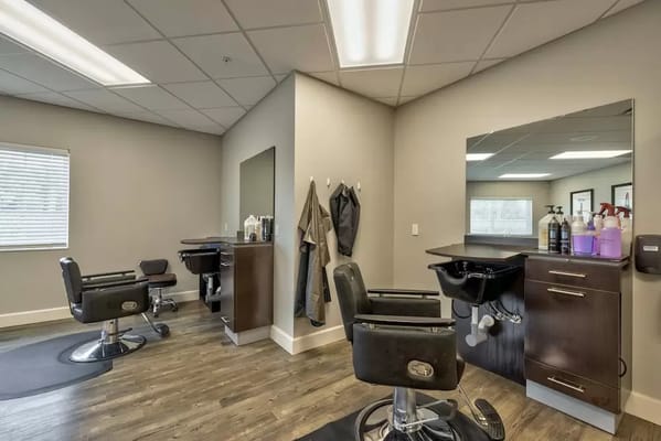 Bright hair salon interior with styling stations