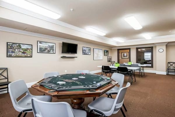 Common area with a poker table and chairs