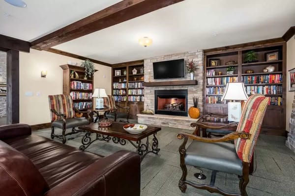Cozy common area with bookshelves and seating