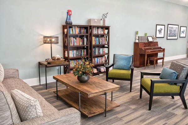 Cozy common area with seating and bookshelves