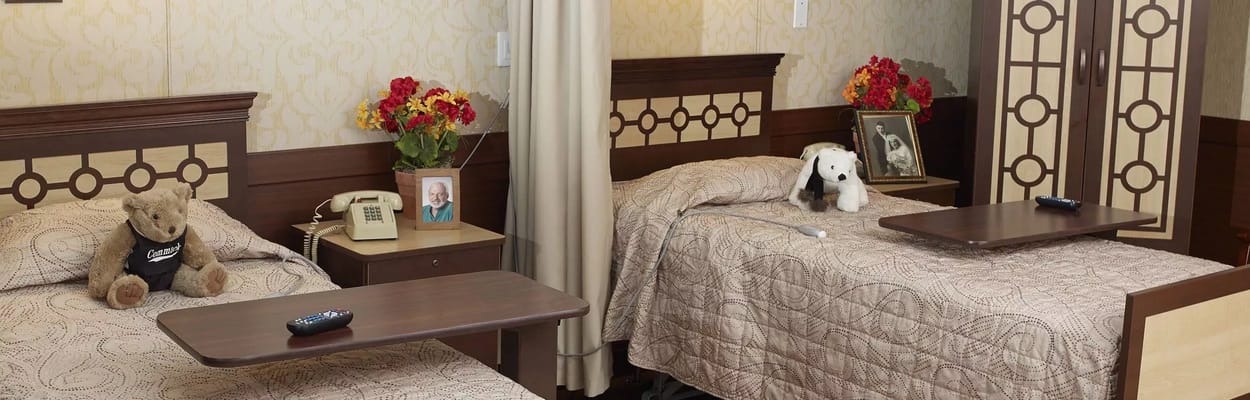 Interior of a private resident room with two beds