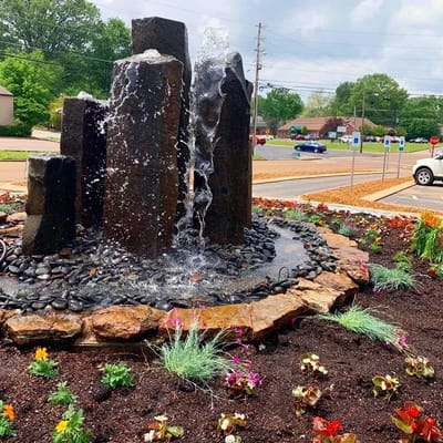 A decorative outdoor water feature in a garden.