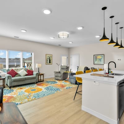 Bright common area with cozy seating and decor